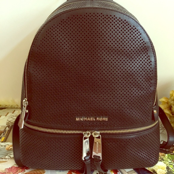 Michael Kors Handbags - Michael Kors Black Perforated Rhea M Backpack